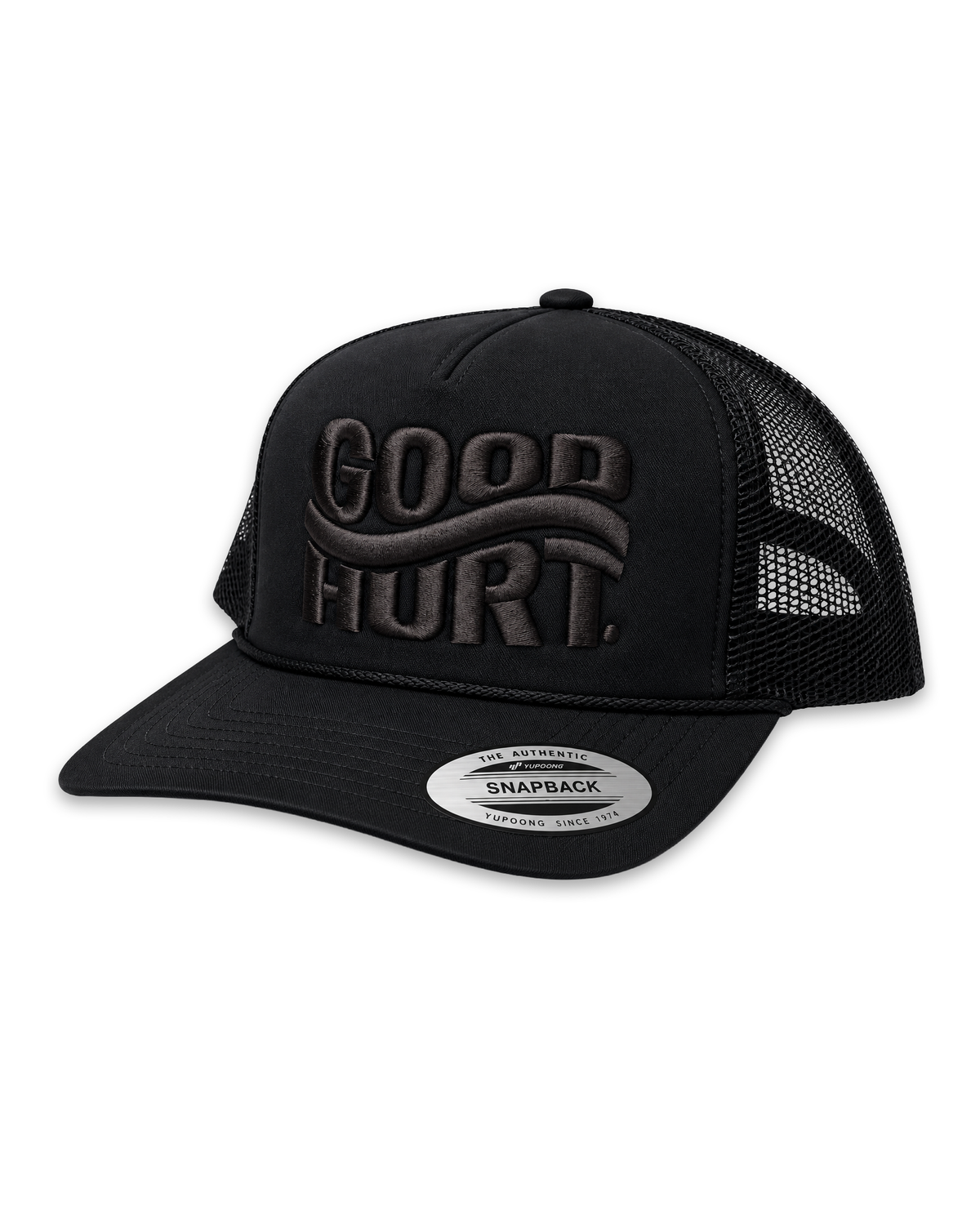 A black trucker hat with a curved brim, black mesh back, and tonal black embroidered 'GOOD HURT' logo on the front. A silver circular sticker on the brim reads 'SNAPBACK'.
