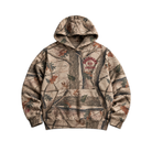 A camouflage pullover hoodie with a realistic woodland tree and leaf print in beige, brown, and green tones, featuring a 'GOOD HURT Athletics' logo on the left chest.