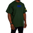 A dark green short-sleeve t-shirt with 'GOOD HURT' printed in blue on the chest and a yellow graphic on the right sleeve, shown on a model against a white background.